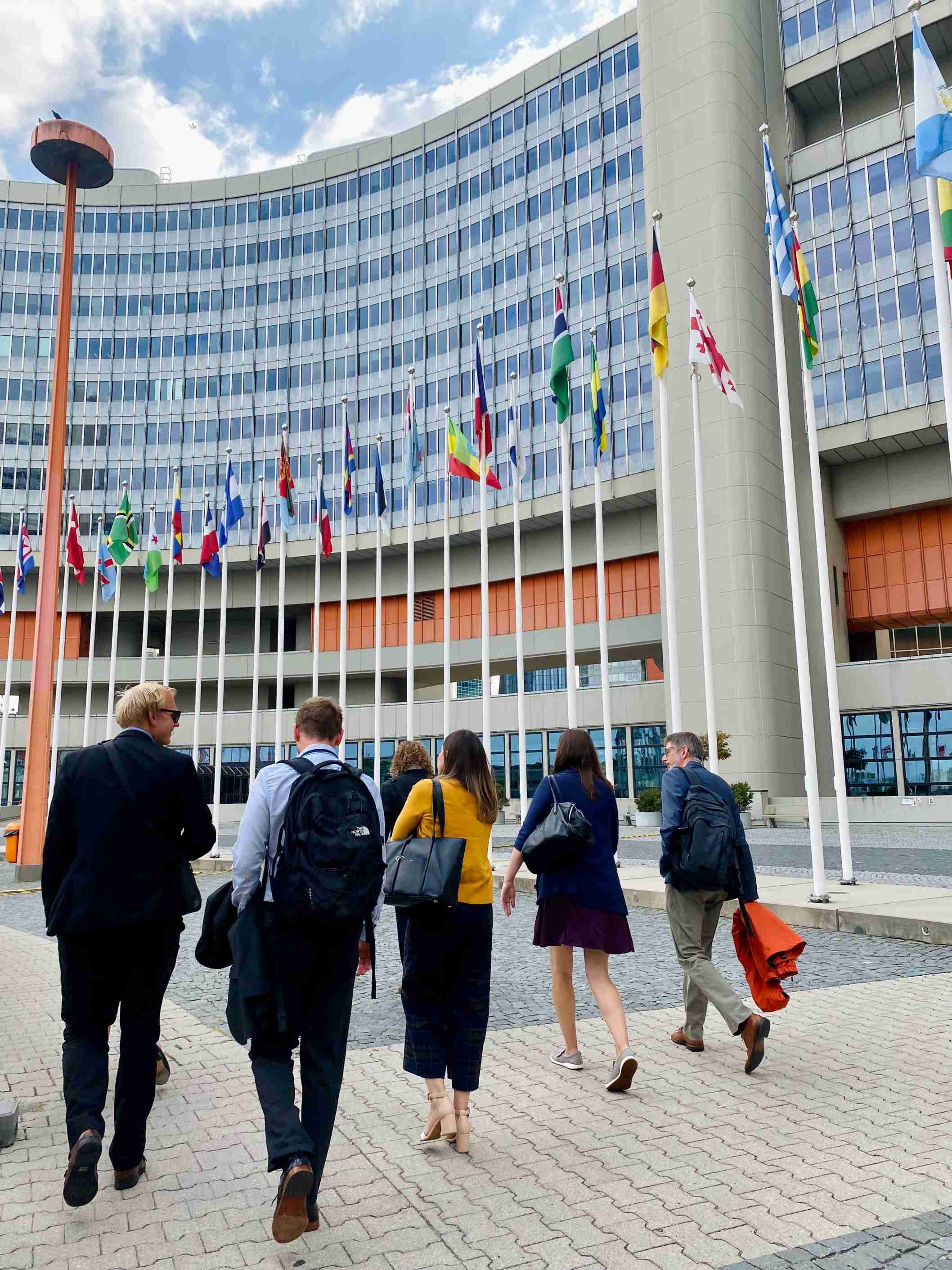 Members walking together to Afterwork @ CopaBeach. Here in front of Vienna International Centre.